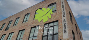 The Vintage building - corner shot - green + white logo overlaid - version 2